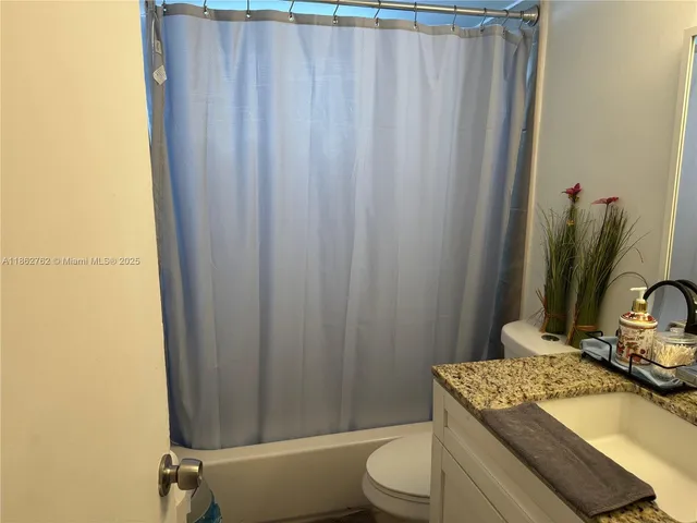 a room with a table and chairs