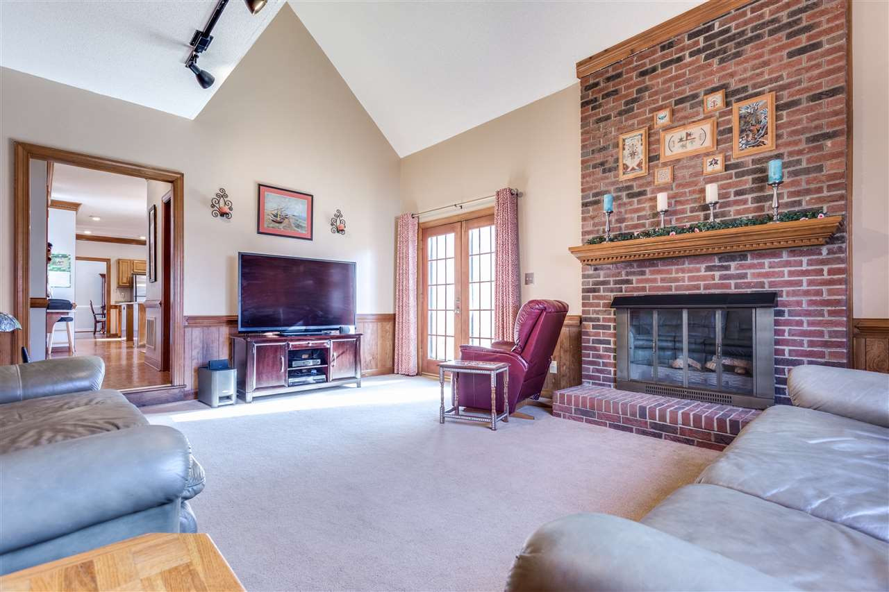 8108 Mourning Dove Road Raleigh, NC 27615 - Photo 18 of 25 COZY SUNKEN FAMILY ROOM WITH VAULTED CEILING INCLUDES A GAS FIREPLACE AND ACCESS TO THE BACK DECK. Family Room