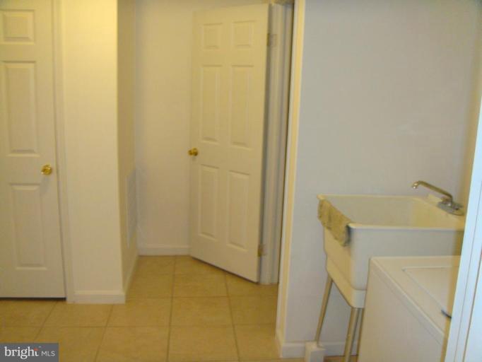 8029 Carbondale Way Springfield, VA 22153 - Photo 13 of 30 a bathroom with a sink and a shower