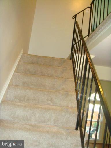 8029 Carbondale Way Springfield, VA 22153 - Photo 21 of 30 a view of staircase with railing and white walls