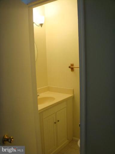 8029 Carbondale Way Springfield, VA 22153 - Photo 26 of 30 a bathroom with a shower and a sink