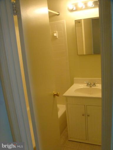 8029 Carbondale Way Springfield, VA 22153 - Photo 27 of 30 a bathroom with a sink and mirror