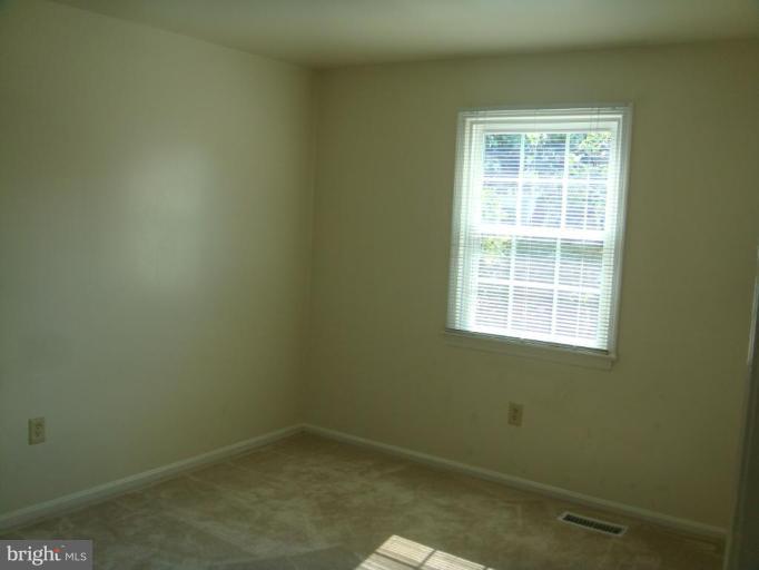 8029 Carbondale Way Springfield, VA 22153 - Photo 29 of 30 an empty room with a window