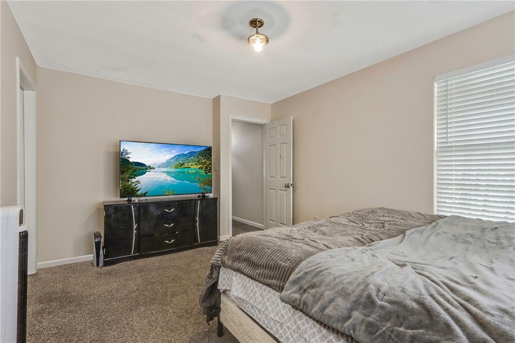 3616 Ginnis Road, Unit 1 Atlanta, GA 30331 - Photo 14 of 20 a bedroom with a bed and a dresser