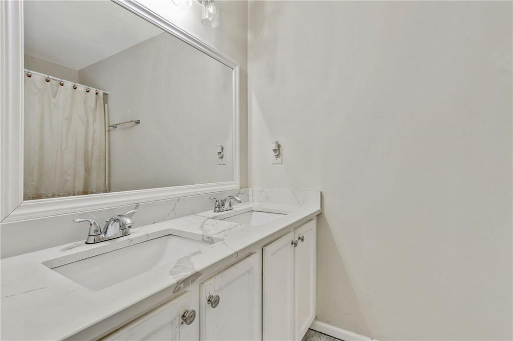 3616 Ginnis Road, Unit 1 Atlanta, GA 30331 - Photo 15 of 20 a bathroom with a sink and a mirror