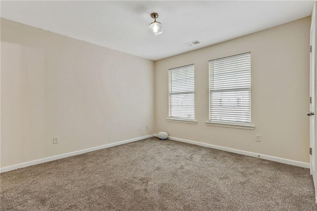 3616 Ginnis Road, Unit 1 Atlanta, GA 30331 - Photo 16 of 20 an empty room with windows