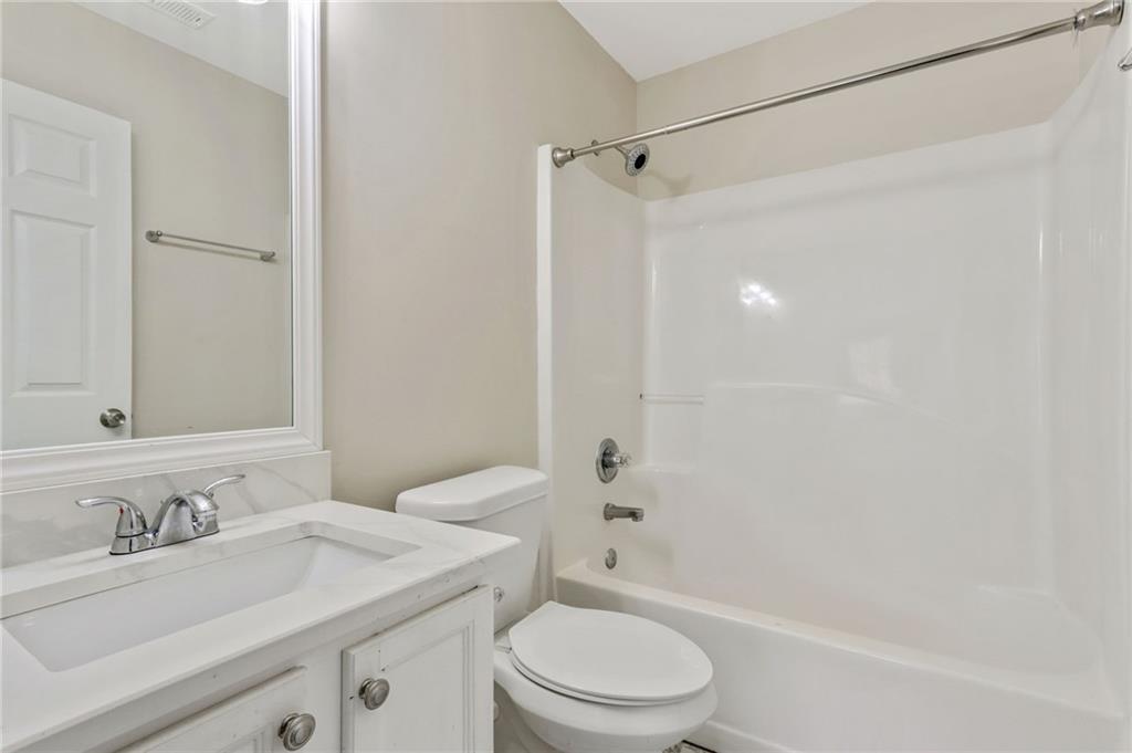 3616 Ginnis Road, Unit 1 Atlanta, GA 30331 - Photo 18 of 20 a bathroom with a sink a toilet and shower