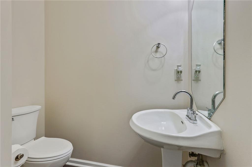 3616 Ginnis Road, Unit 1 Atlanta, GA 30331 - Photo 7 of 20 a bathroom with a sink a toilet and a mirror