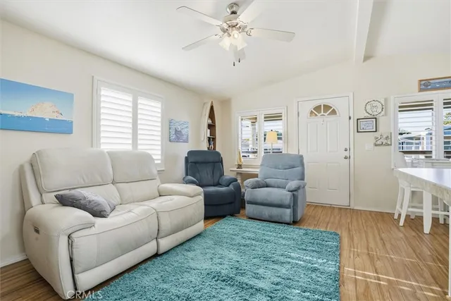 a living room with furniture and a rug