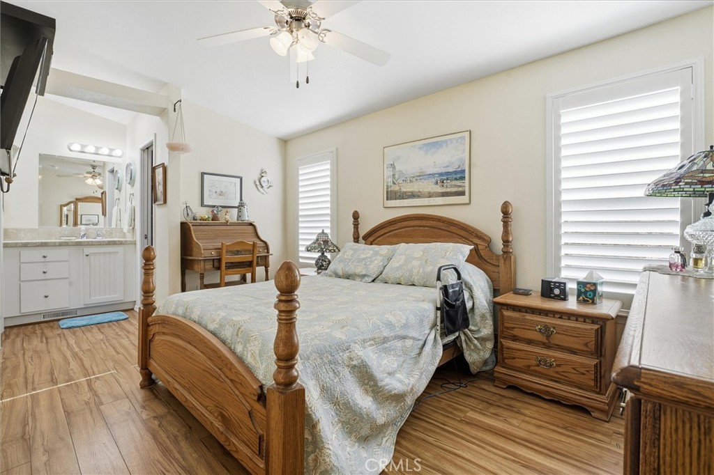 500 Atascadero Road Morro Bay, CA 93442 - Photo 17 of 27 a bedroom with a bed and wooden floor