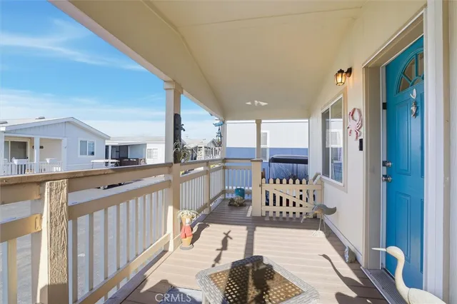 a view of a balcony with furniture