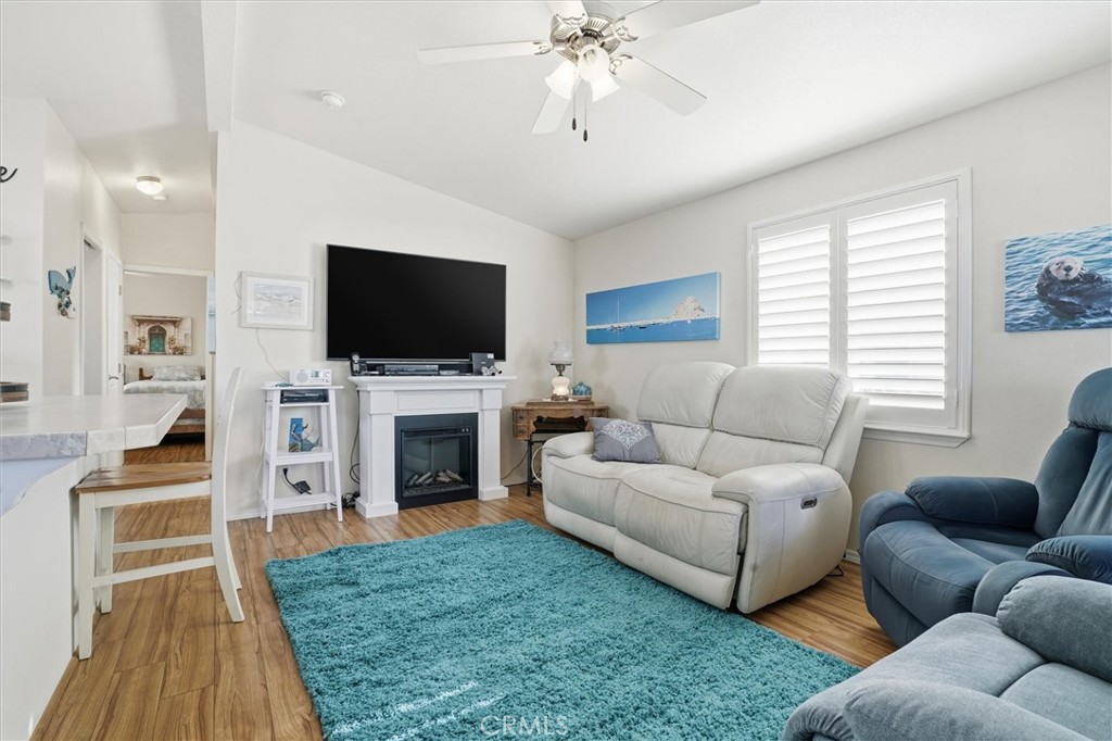 500 Atascadero Road Morro Bay, CA 93442 - Photo 10 of 27 a living room with furniture a fireplace and a flat screen tv