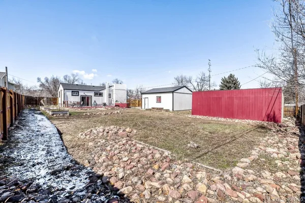 a house view with a backyard space