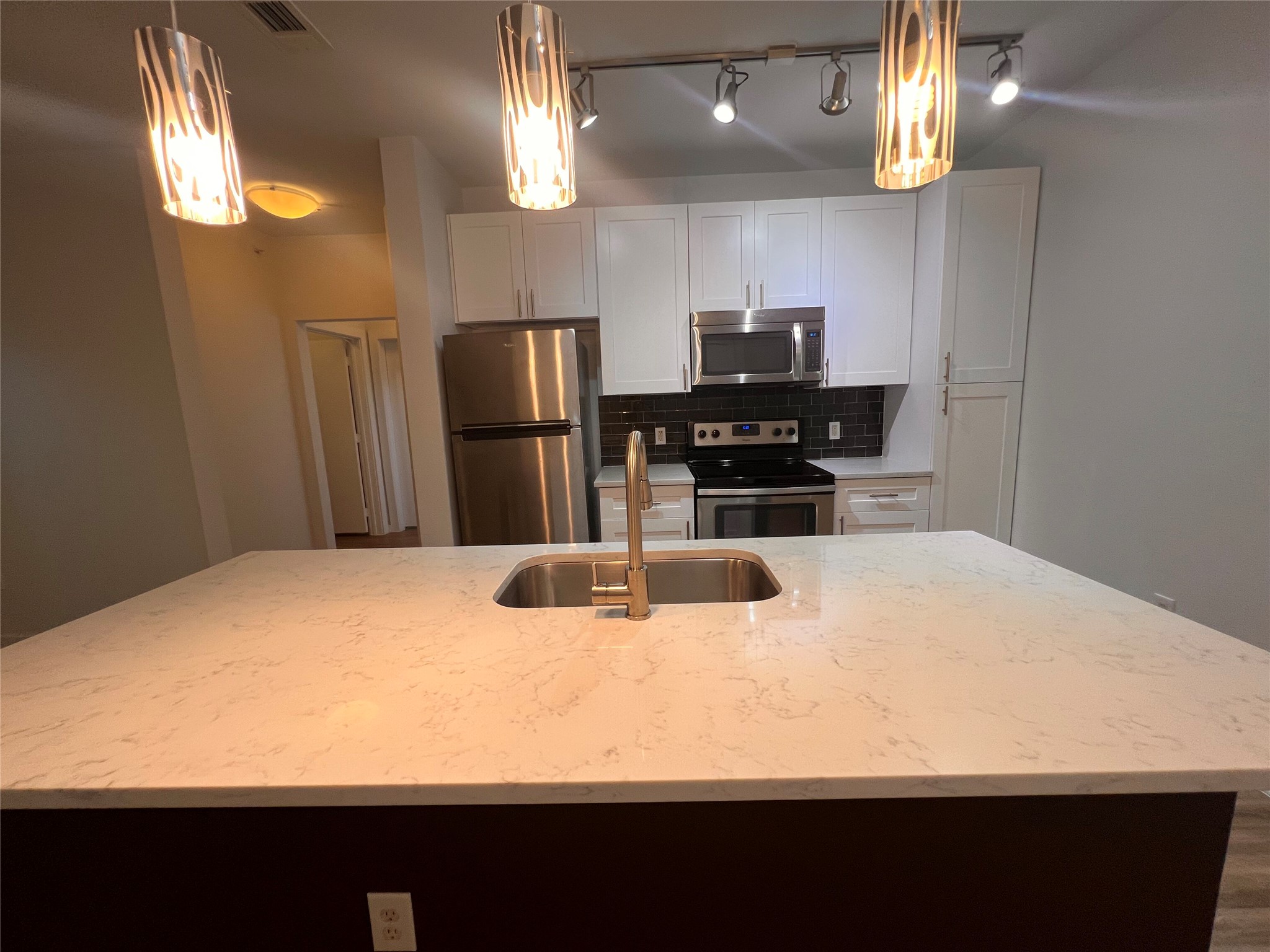 1900 Barton Springs Road, Unit 4041 Austin, TX 78704 - Photo 15 of 35 a kitchen with a refrigerator a stove and a sink