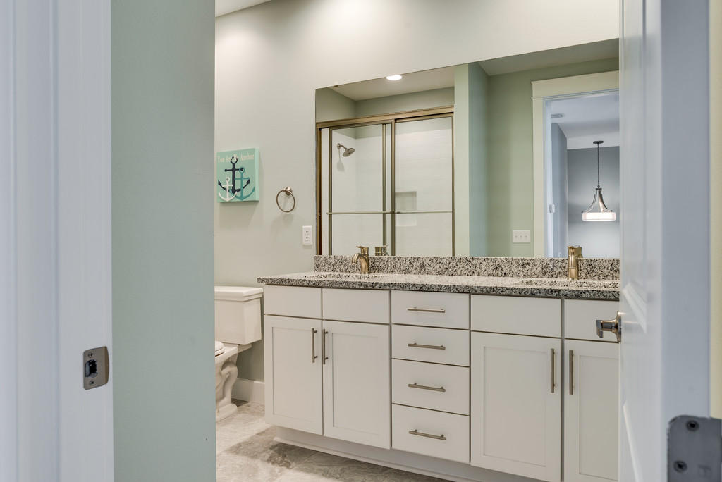 Lot 86 Constant Avenue Santa Rosa Beach, FL 32459 - Photo 13 of 31 a bathroom with a granite countertop sink and a mirror
