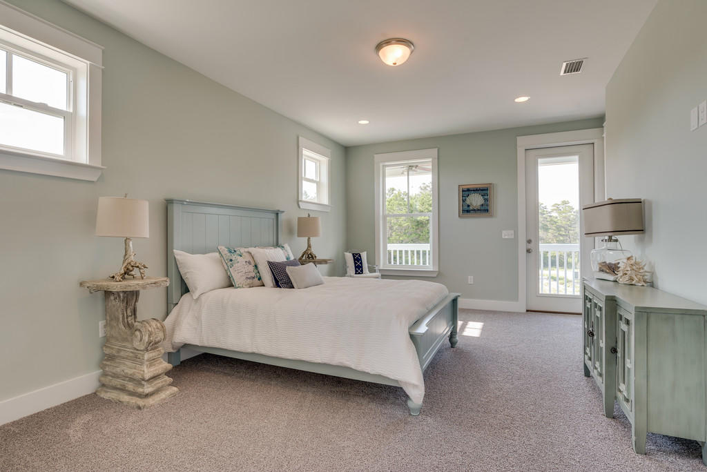 Lot 86 Constant Avenue Santa Rosa Beach, FL 32459 - Photo 18 of 31 a spacious bedroom with a bed and a cabinets