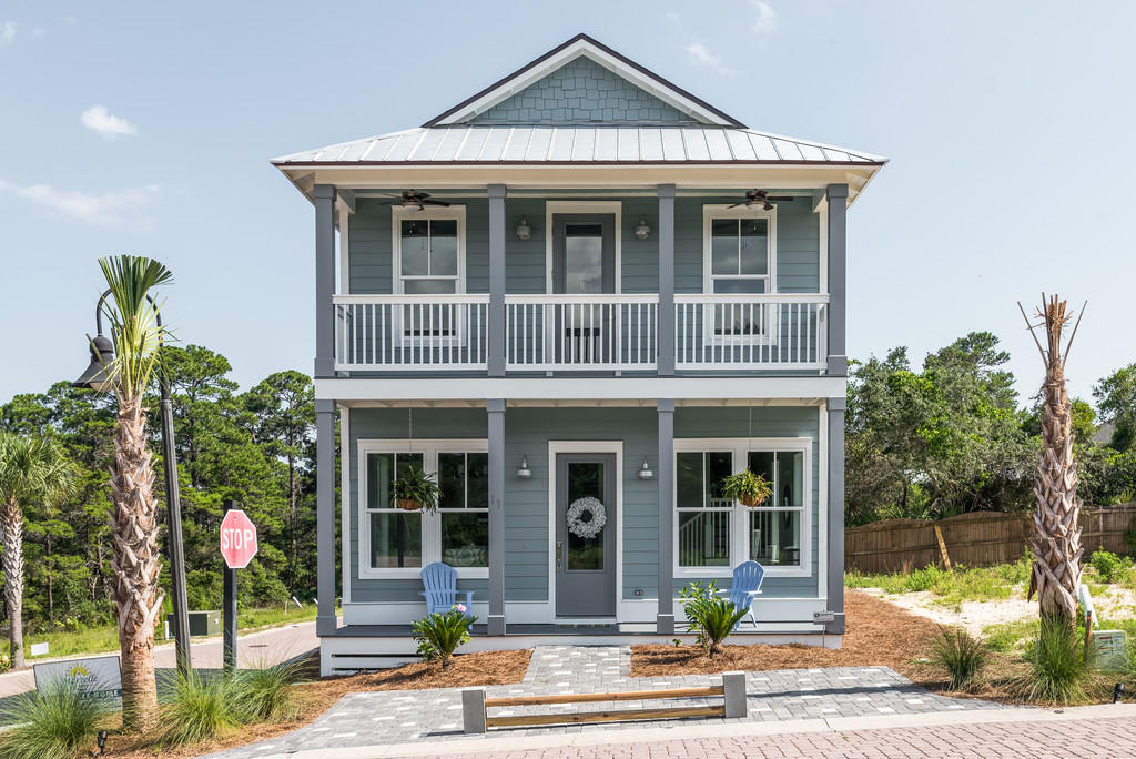 Lot 86 Constant Avenue Santa Rosa Beach, FL 32459 - Photo 2 of 31 a front view of a house with a garden and plants
