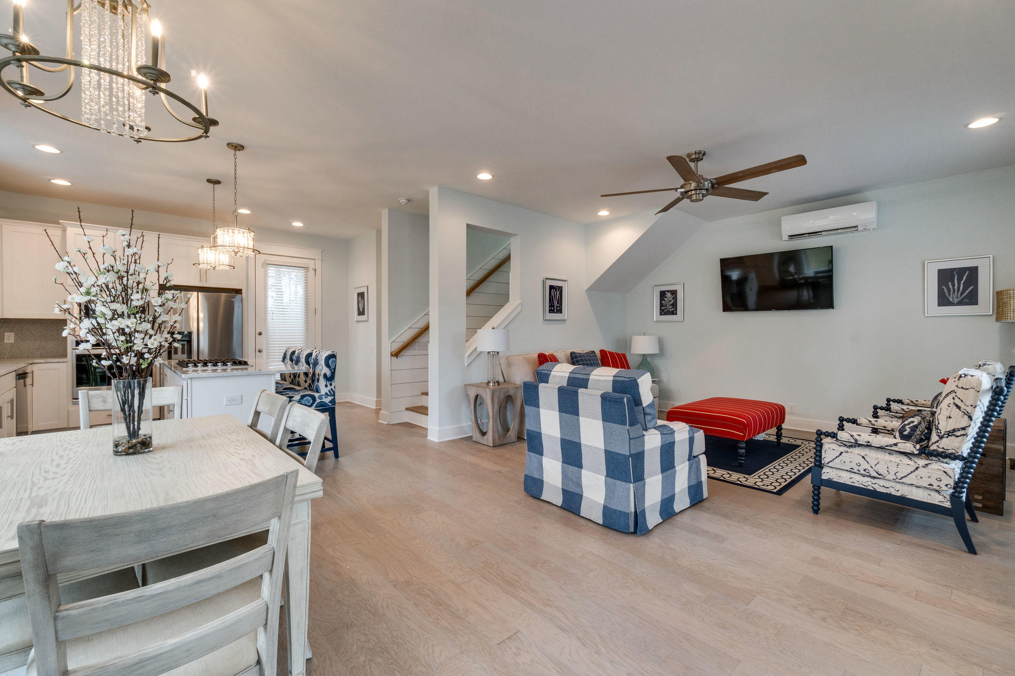 Lot 86 Constant Avenue Santa Rosa Beach, FL 32459 - Photo 27 of 31 a living room with furniture a chandelier and a flat screen tv