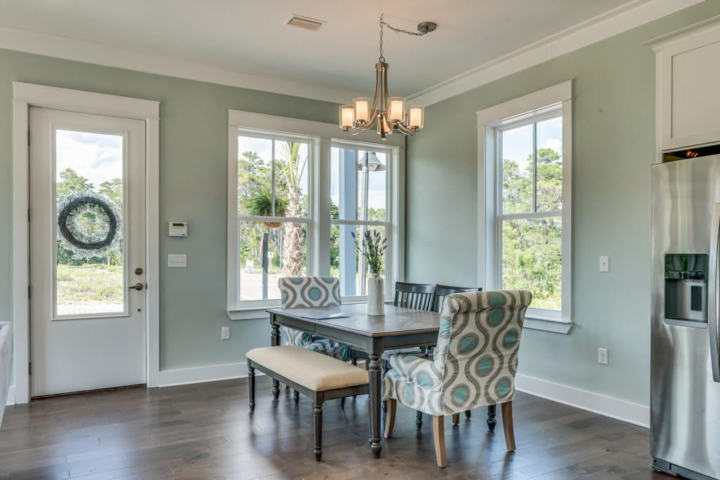 Lot 86 Constant Avenue Santa Rosa Beach, FL 32459 - Photo 8 of 31 a view of a dining room with furniture window and wooden floor