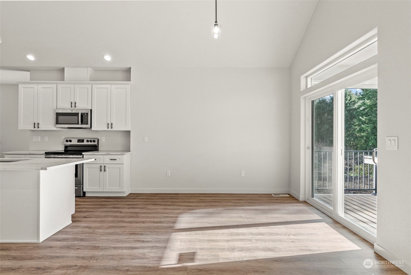 147 Hunter Road Longview, WA 98632 - Photo 12 of 31 a kitchen with white cabinets and appliances