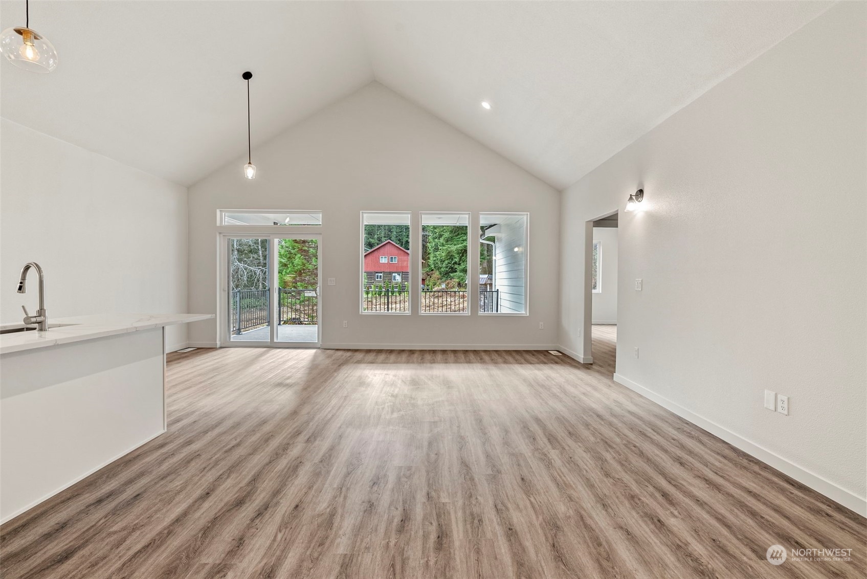 147 Hunter Road Longview, WA 98632 - Photo 14 of 31 a view of an empty room with wooden floor and a window