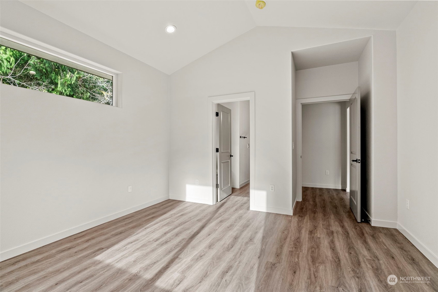147 Hunter Road Longview, WA 98632 - Photo 17 of 31 a view of a room with wooden floor and a window