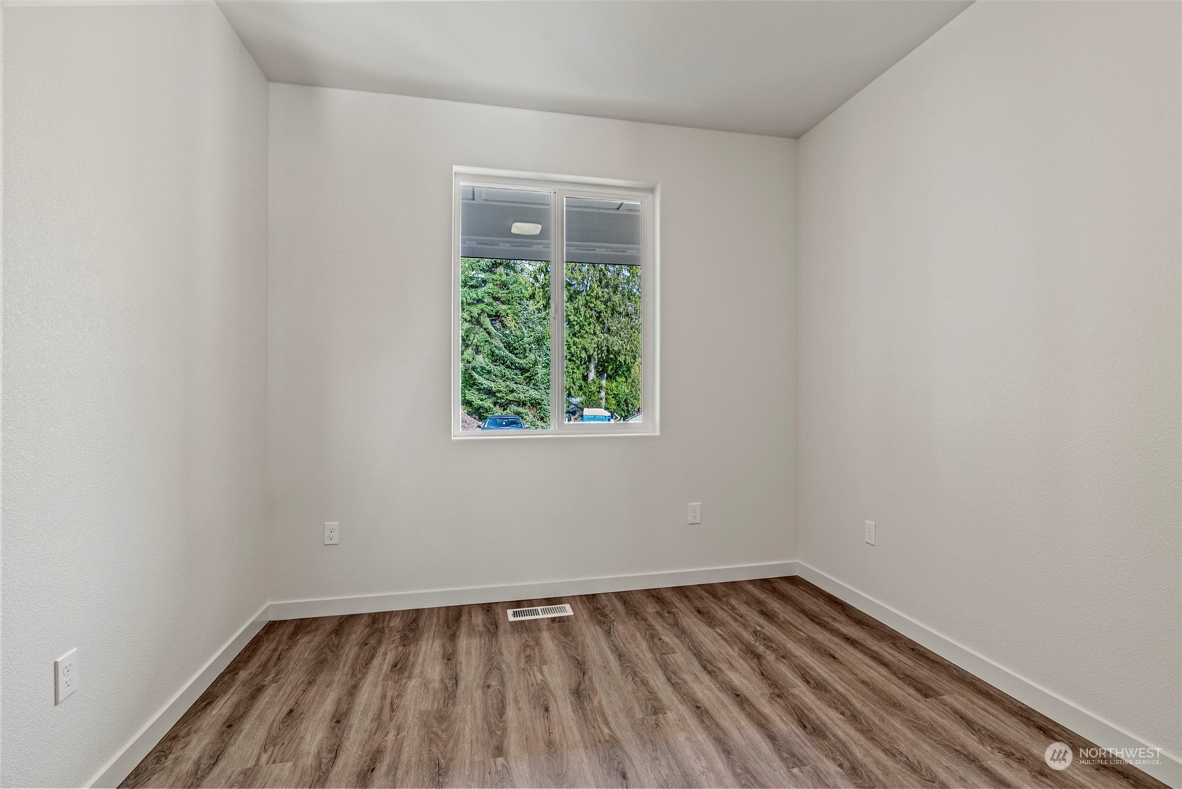 147 Hunter Road Longview, WA 98632 - Photo 25 of 31 a view of an empty room with wooden floor and a window