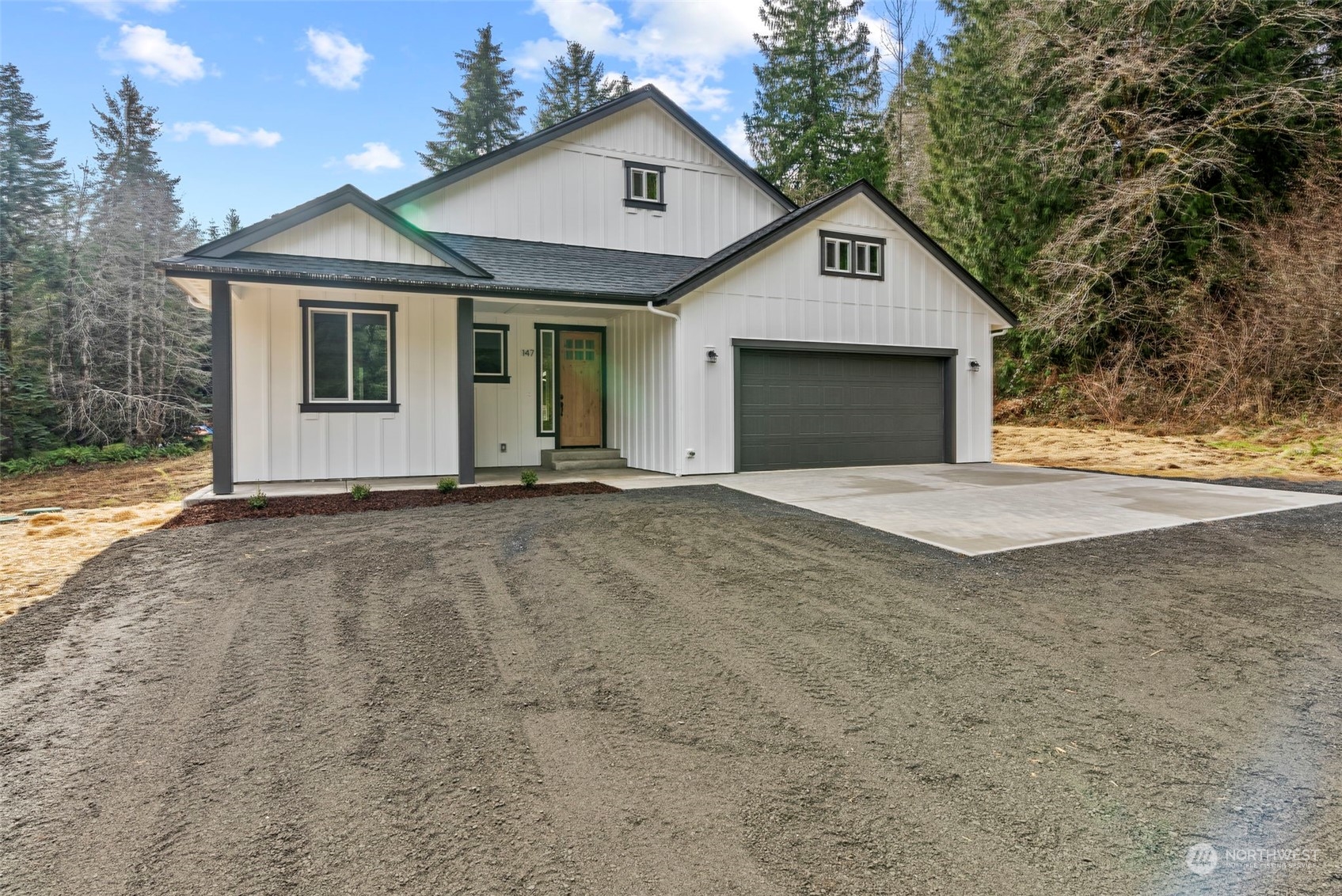 147 Hunter Road Longview, WA 98632 - Photo 3 of 31 a front view of a house with a yard and garage