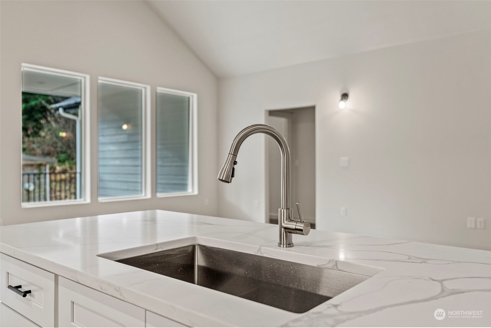 147 Hunter Road Longview, WA 98632 - Photo 9 of 31 a kitchen with a sink and a large mirror next to a window