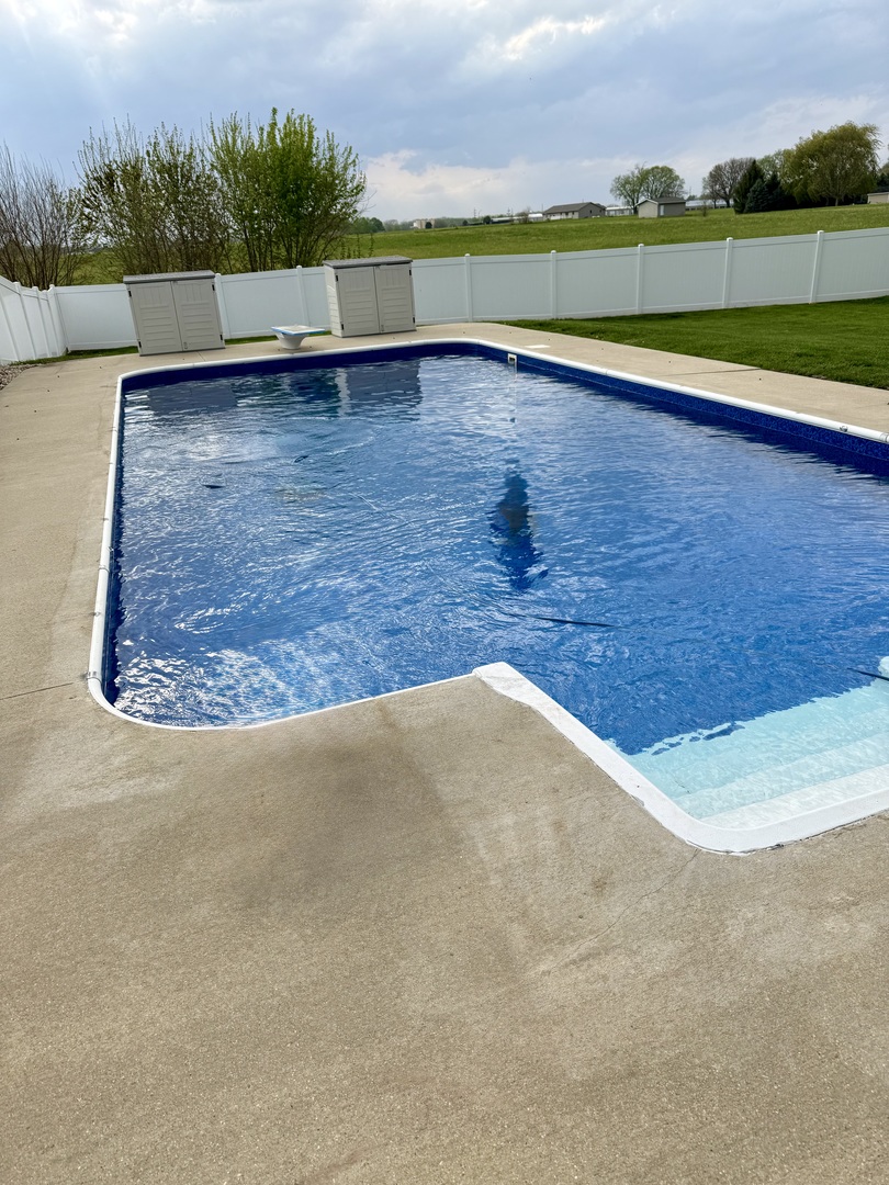 12795 Lawrence Road Sterling, IL 61081 - Photo 9 of 42 a view of swimming pool and mountain in the back