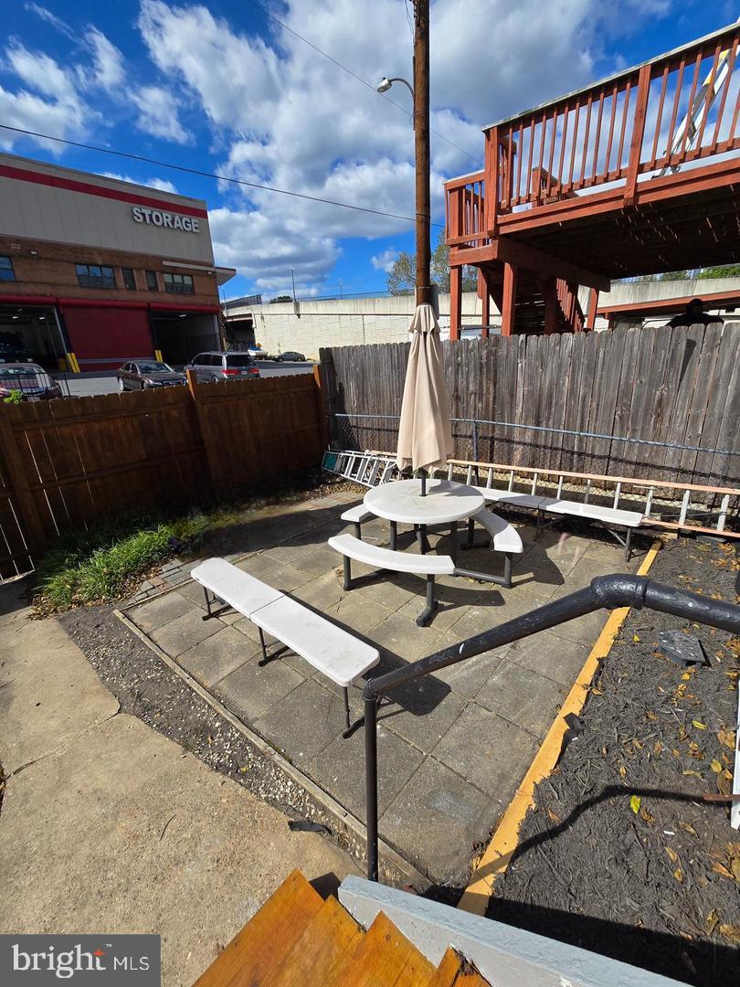 4044 7th Street Northeast, Unit 4 Washington, DC 20017 - Photo 9 of 9 a view of a patio with table and chairs with wooden floor