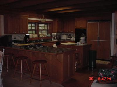 13645 Millerton Road Prather, CA 93651 - Photo 6 of 9 Kitchen. Green tile counters, center island, custom refrigrator stays.