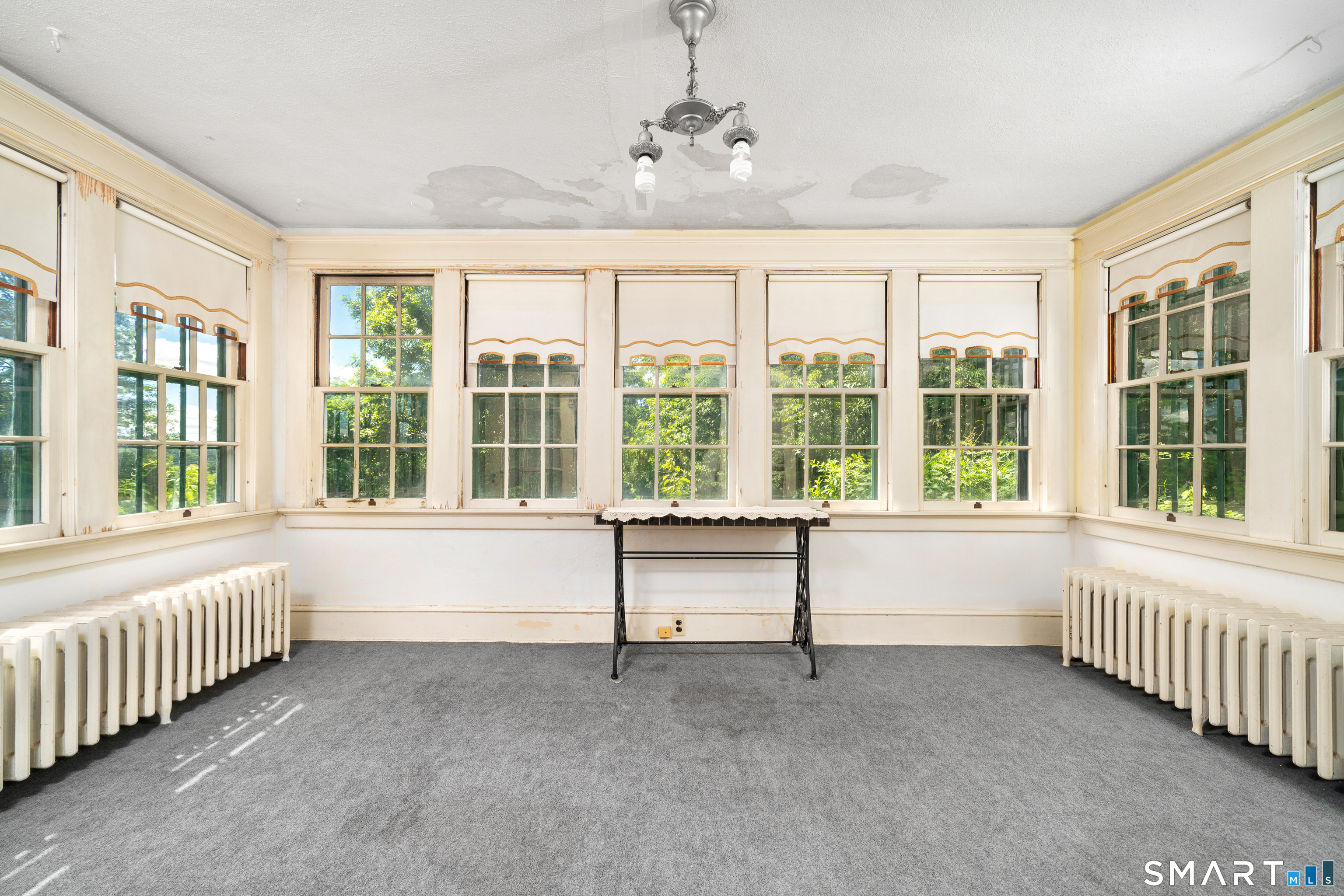 29 South Main Street Windsor Locks, CT 06096 - Photo 12 of 34 The sunroom would be perfect for morning coffees, cocoa during a snowstorm or a home office