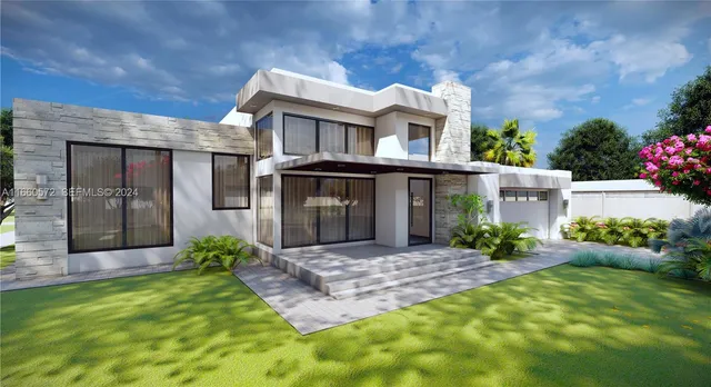 a view of a house with a small yard and plants