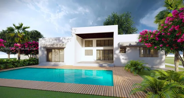 a front view of small house with yard and green space