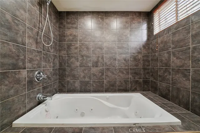 a bathroom with a bath tub