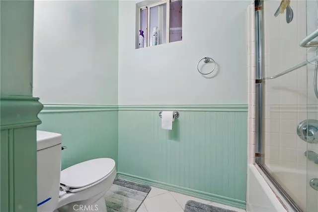 a bathroom with a toilet and a sink