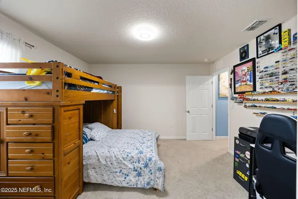 a view of a patio with chairs and a table