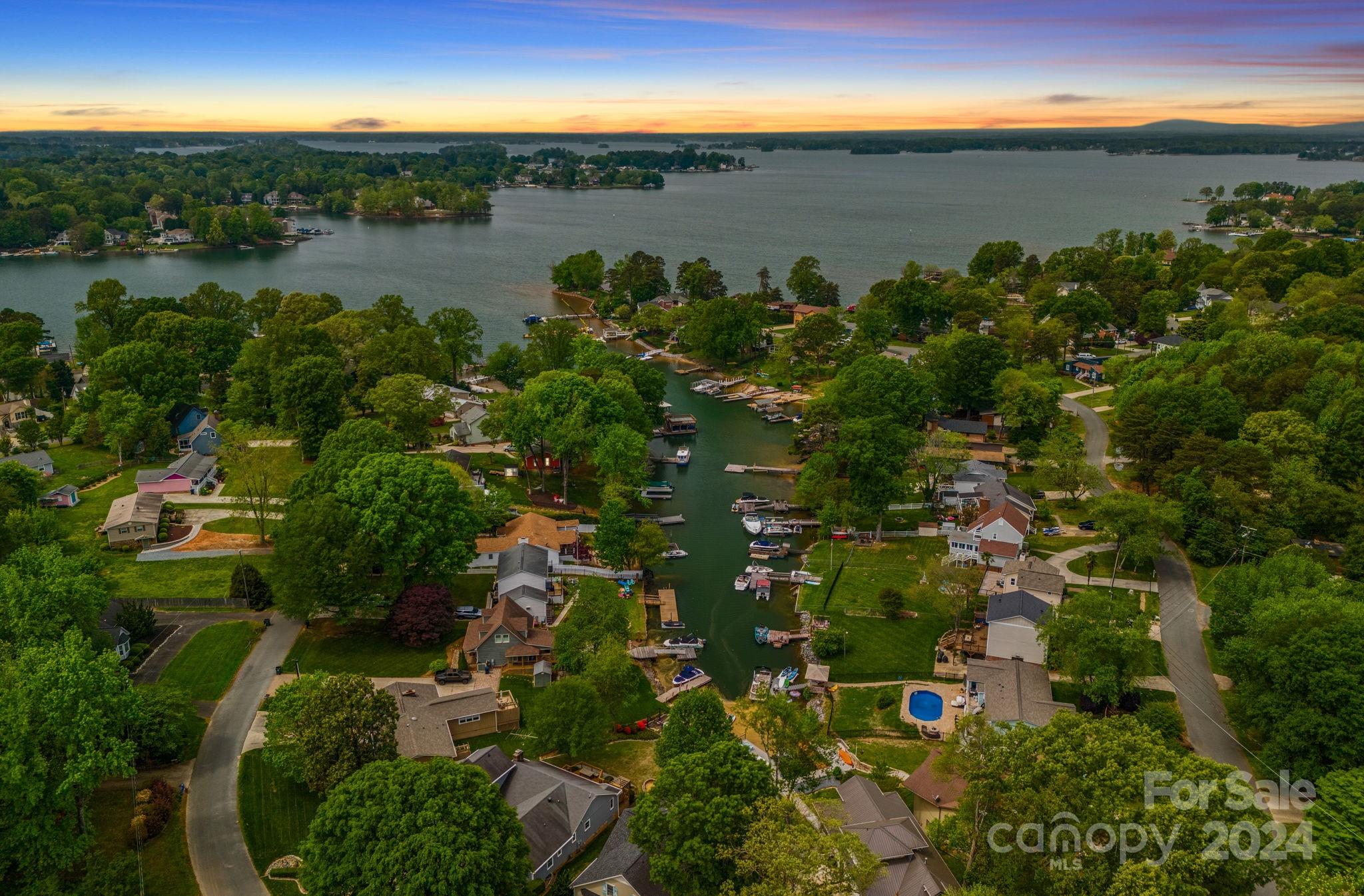 an aerial view of a houses with a yard
