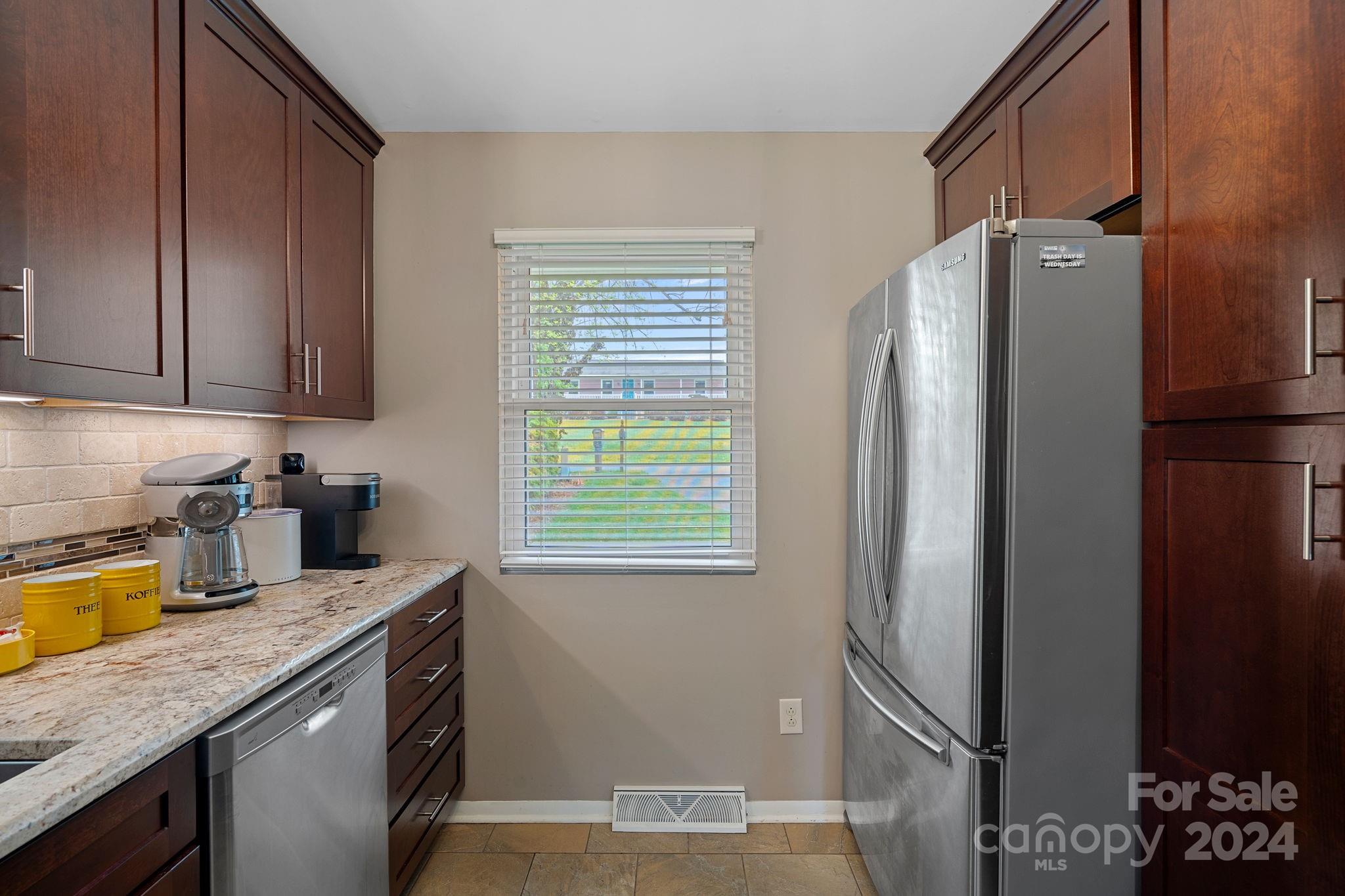 21212 Rio Oro Drive Cornelius, NC 28031 - Photo 15 of 41 a kitchen with stainless steel appliances granite countertop a refrigerator and a sink