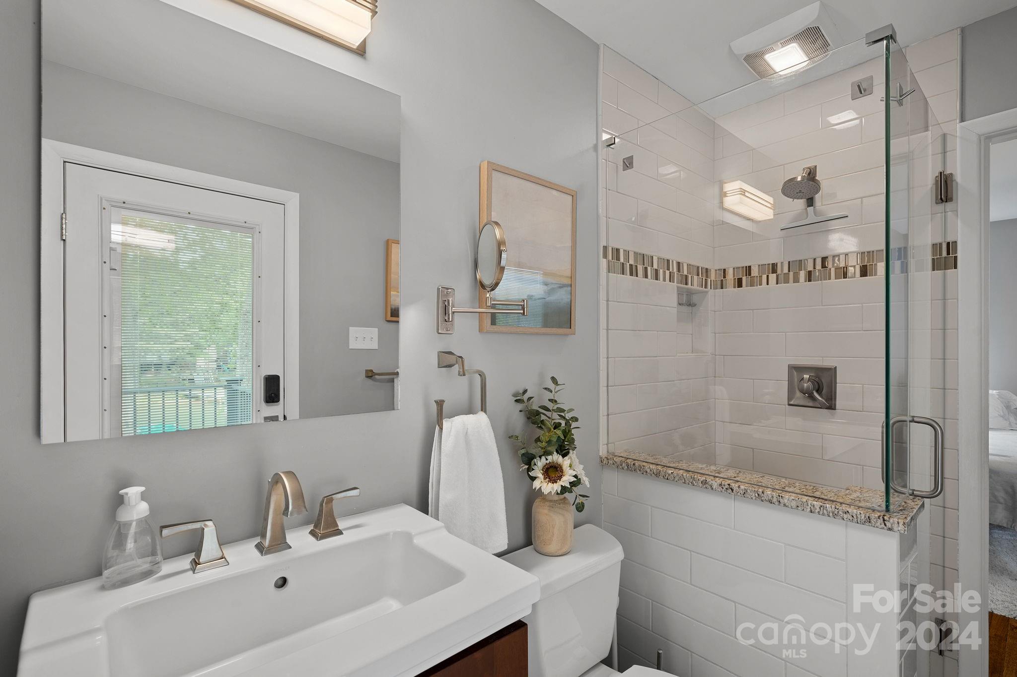 21212 Rio Oro Drive Cornelius, NC 28031 - Photo 21 of 41 a bathroom with a sink a toilet and shower