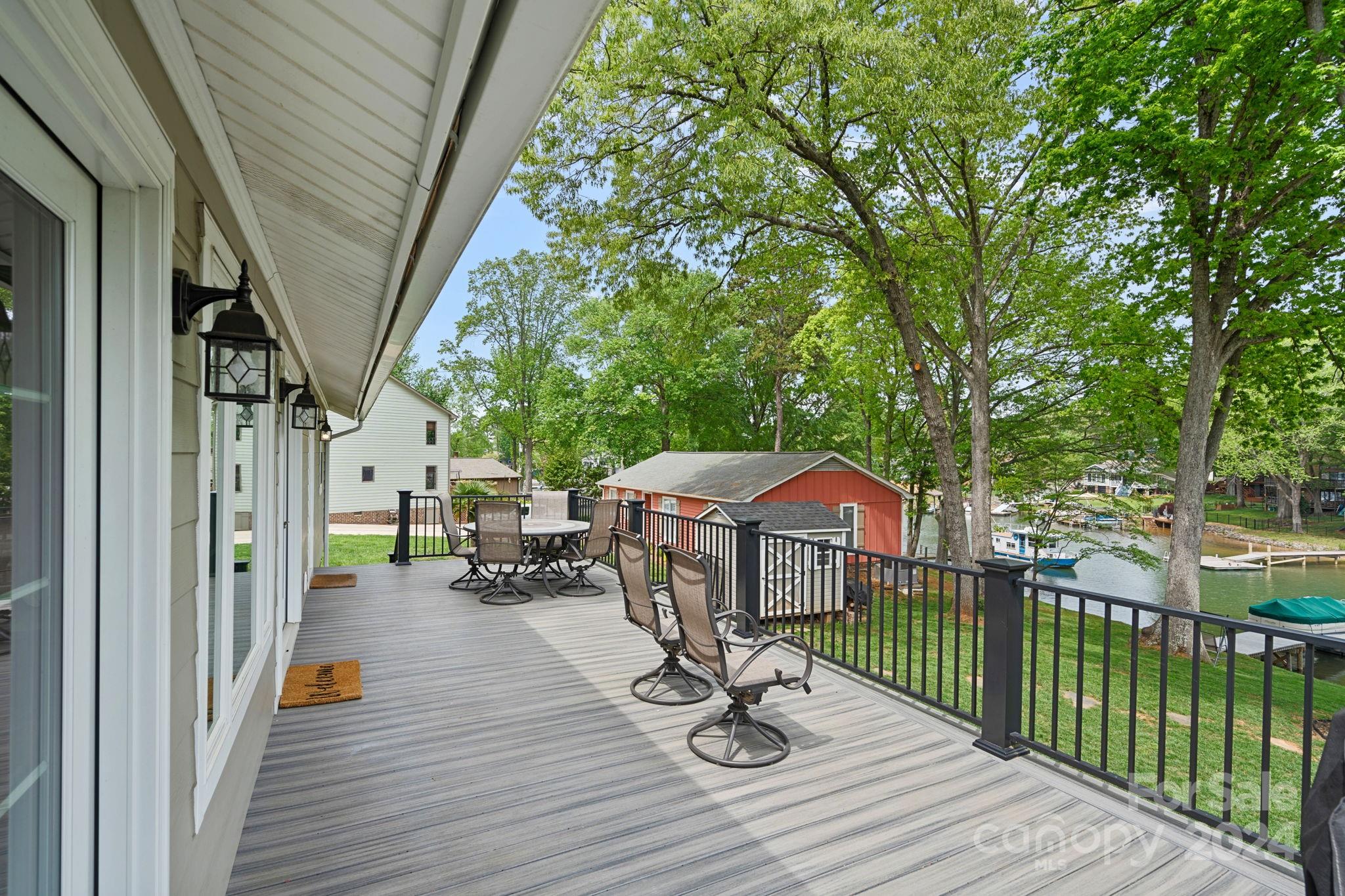 21212 Rio Oro Drive Cornelius, NC 28031 - Photo 24 of 41 a view of a deck with chairs and wooden fence