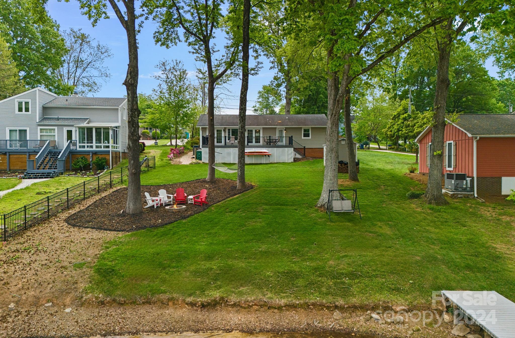 21212 Rio Oro Drive Cornelius, NC 28031 - Photo 26 of 41 a view of a house with a backyard and a tree