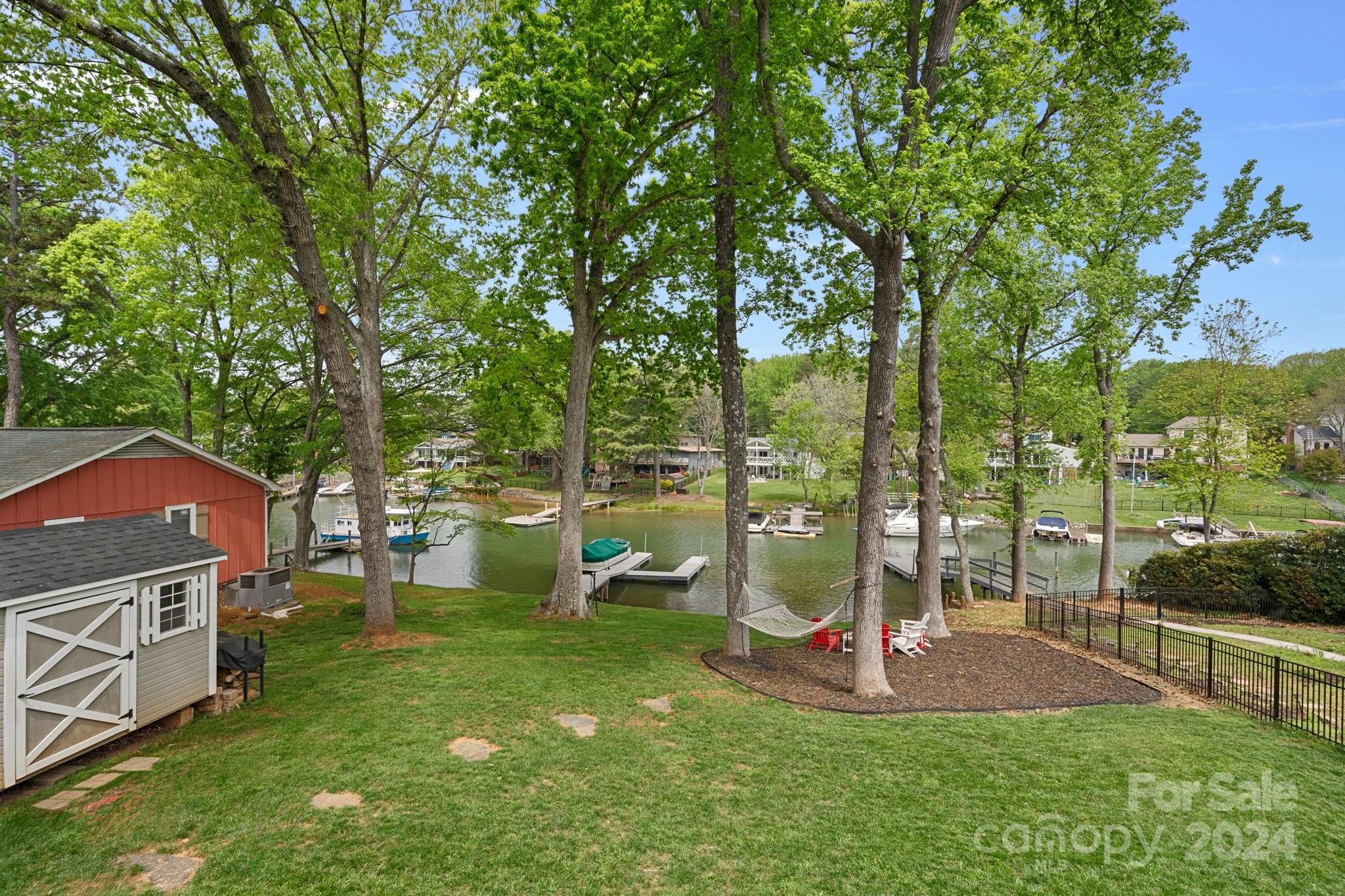 21212 Rio Oro Drive Cornelius, NC 28031 - Photo 27 of 41 a view of a chairs and table in backyard