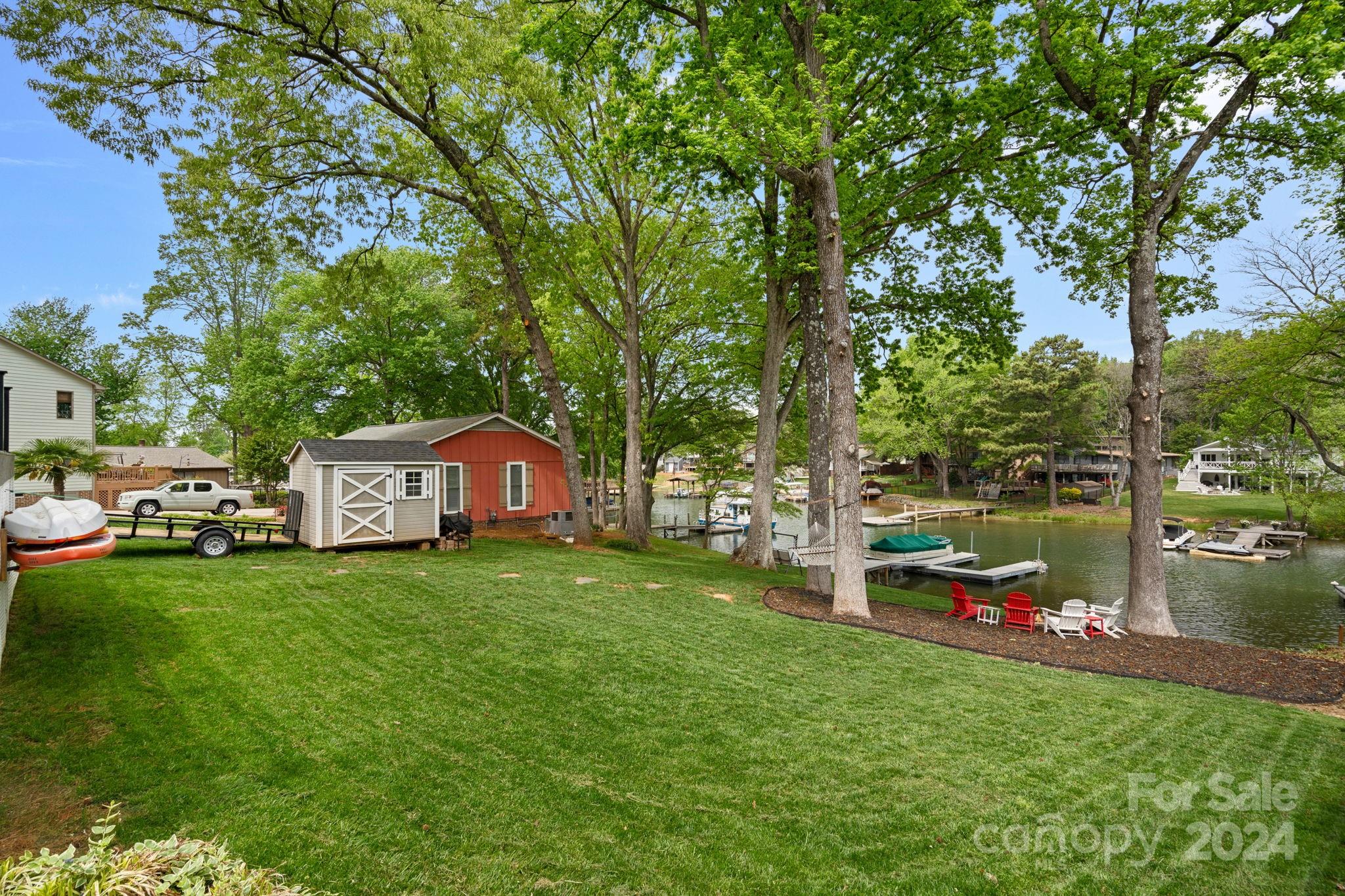 21212 Rio Oro Drive Cornelius, NC 28031 - Photo 29 of 41 a front view of a house with a yard table and chairs