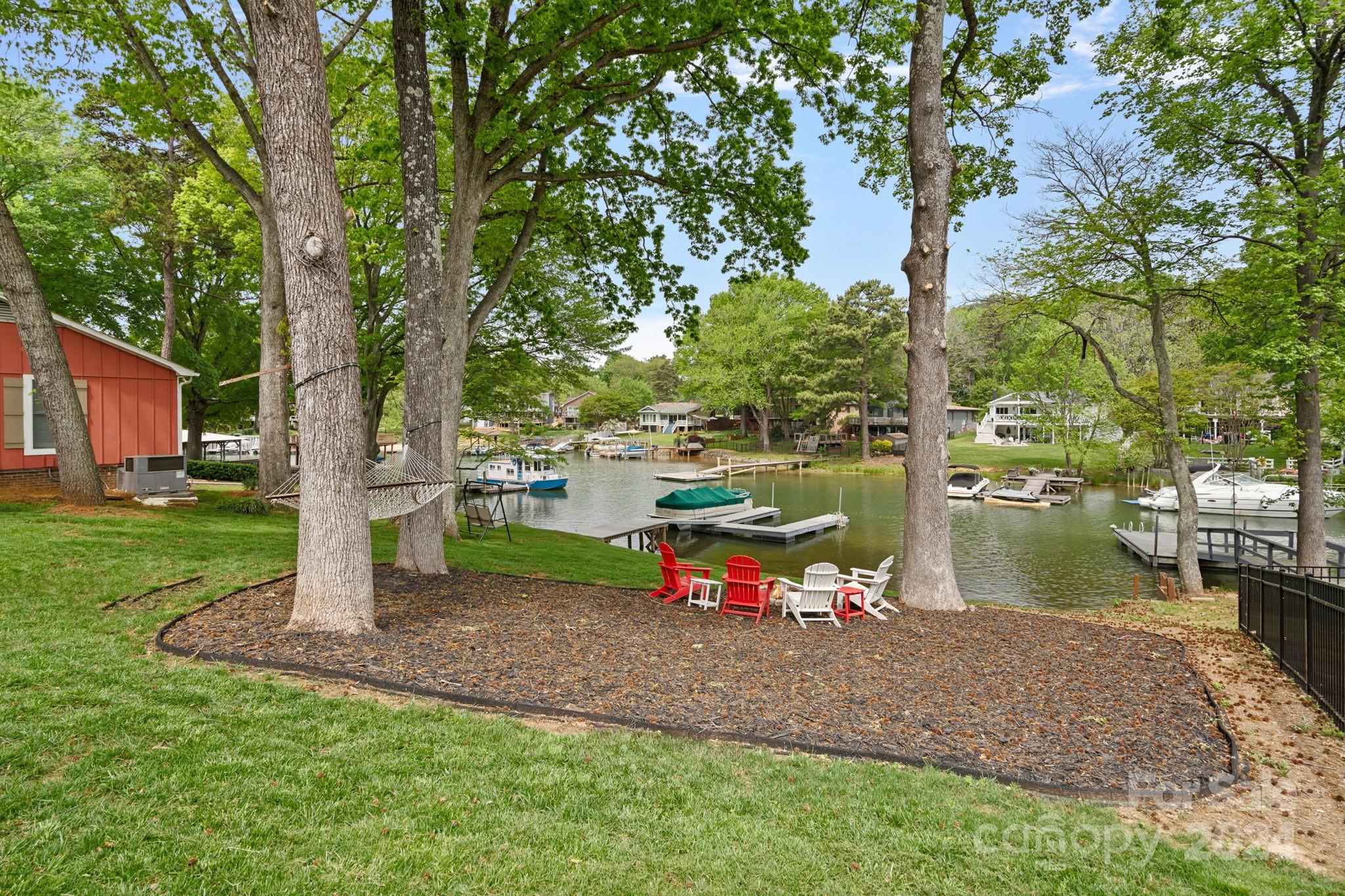 21212 Rio Oro Drive Cornelius, NC 28031 - Photo 31 of 41 a view of a lake with a tree in the park
