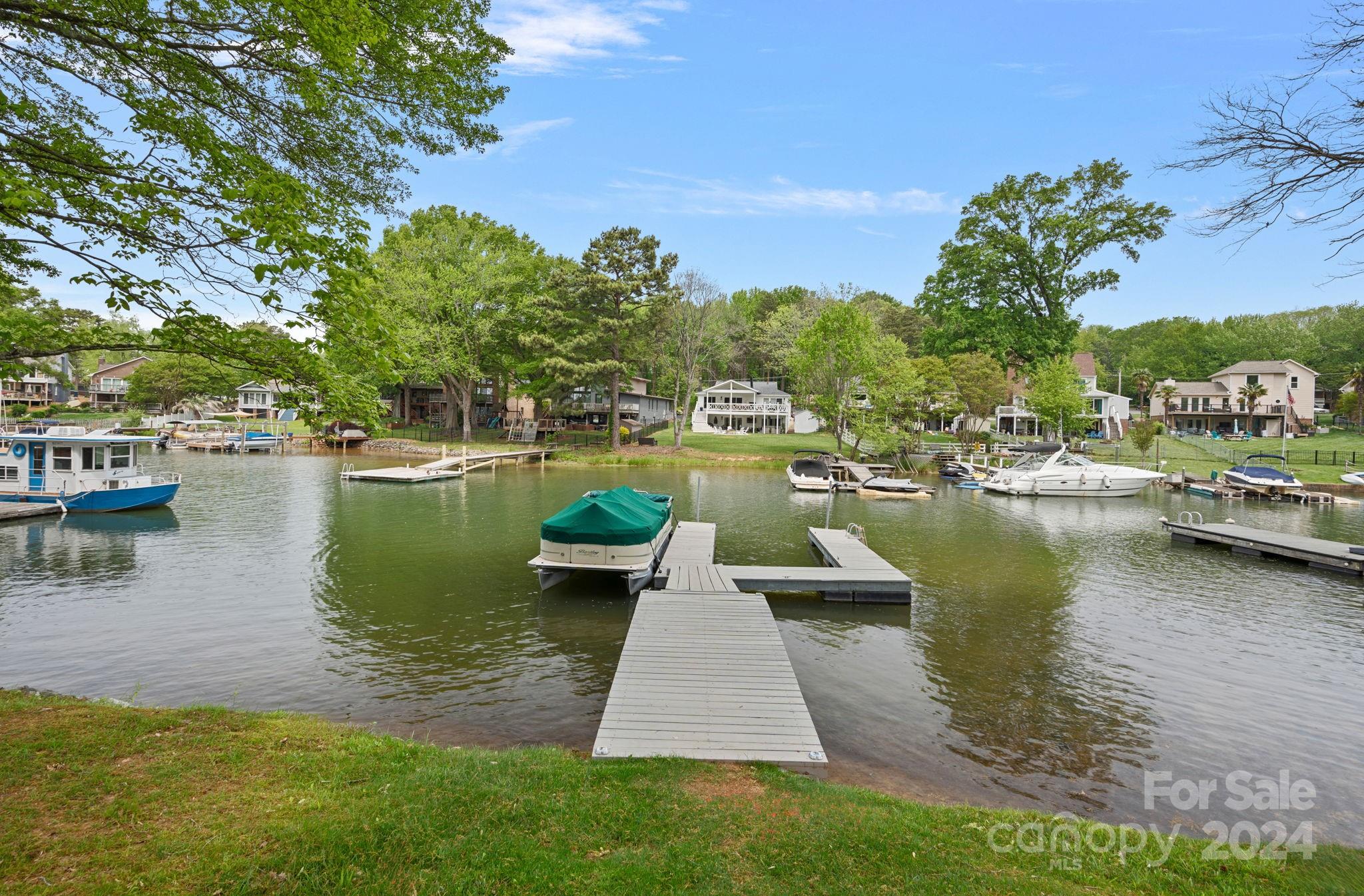 21212 Rio Oro Drive Cornelius, NC 28031 - Photo 33 of 41 a view of a lake with houses