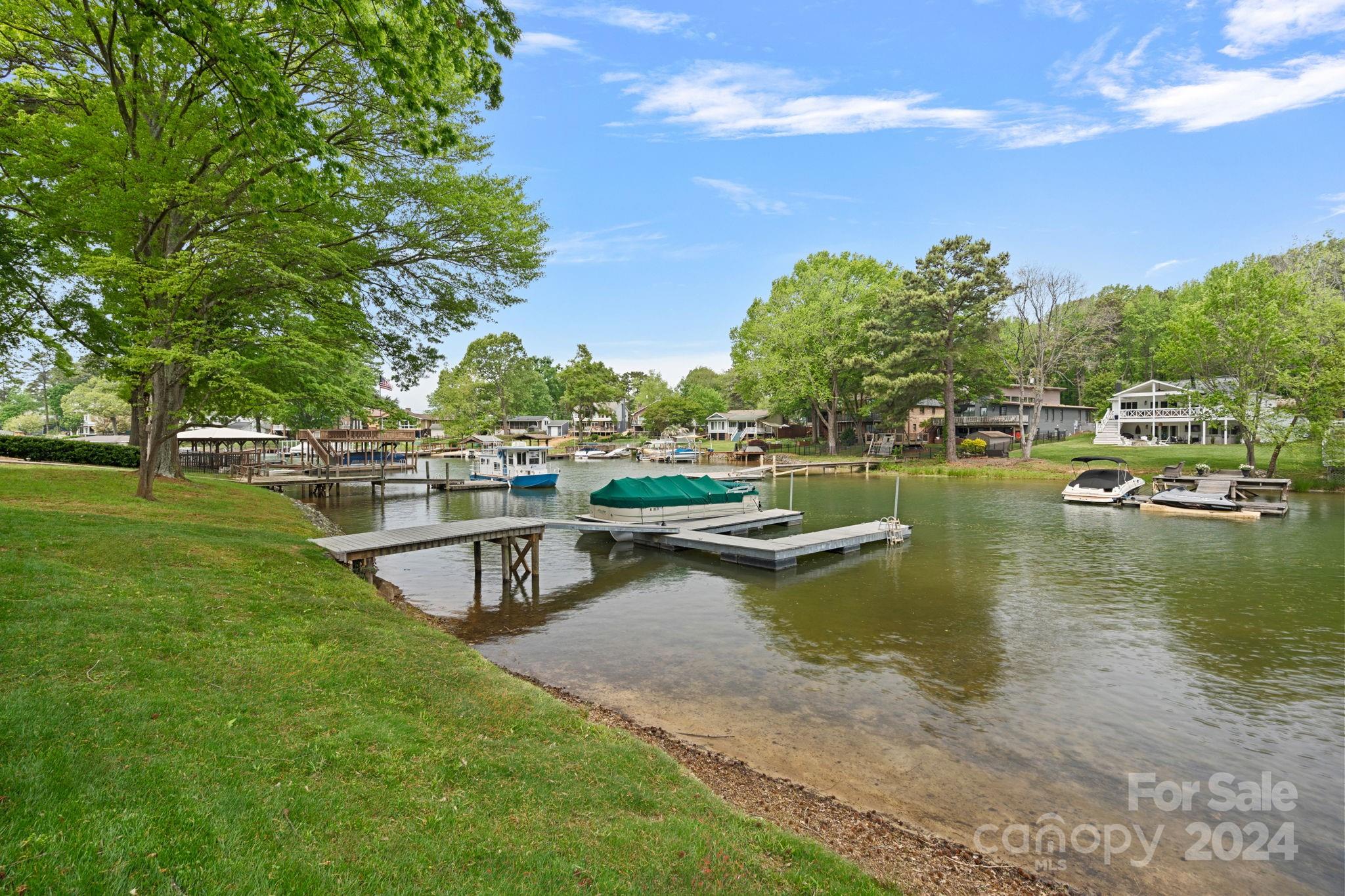21212 Rio Oro Drive Cornelius, NC 28031 - Photo 35 of 41 a view of a lake with houses in the back