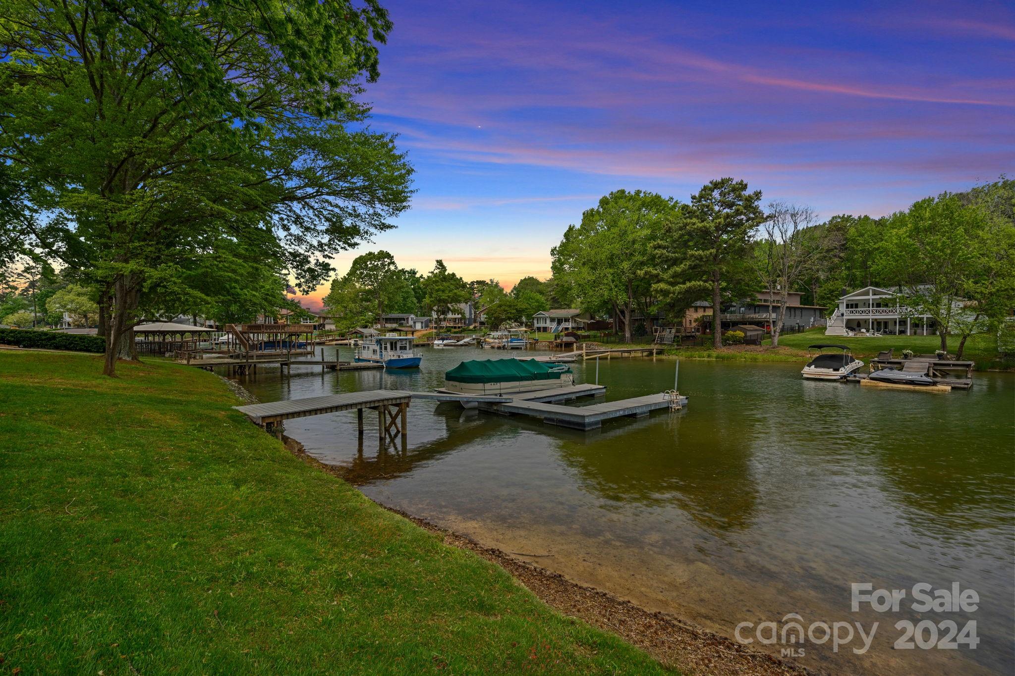 21212 Rio Oro Drive Cornelius, NC 28031 - Photo 36 of 41 a view of a lake with houses in the back