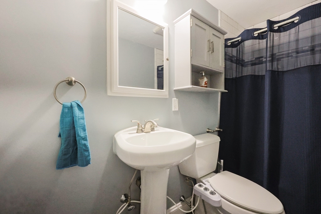 23 Superior Road Worcester, MA 01604 - Photo 14 of 32 a bathroom with a sink a toilet and shower